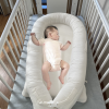 baby sleeping in nest